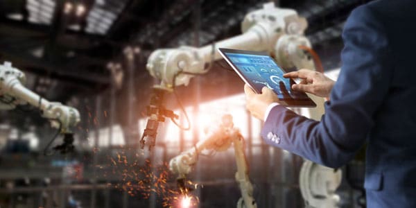 man controlling roboters with tablet